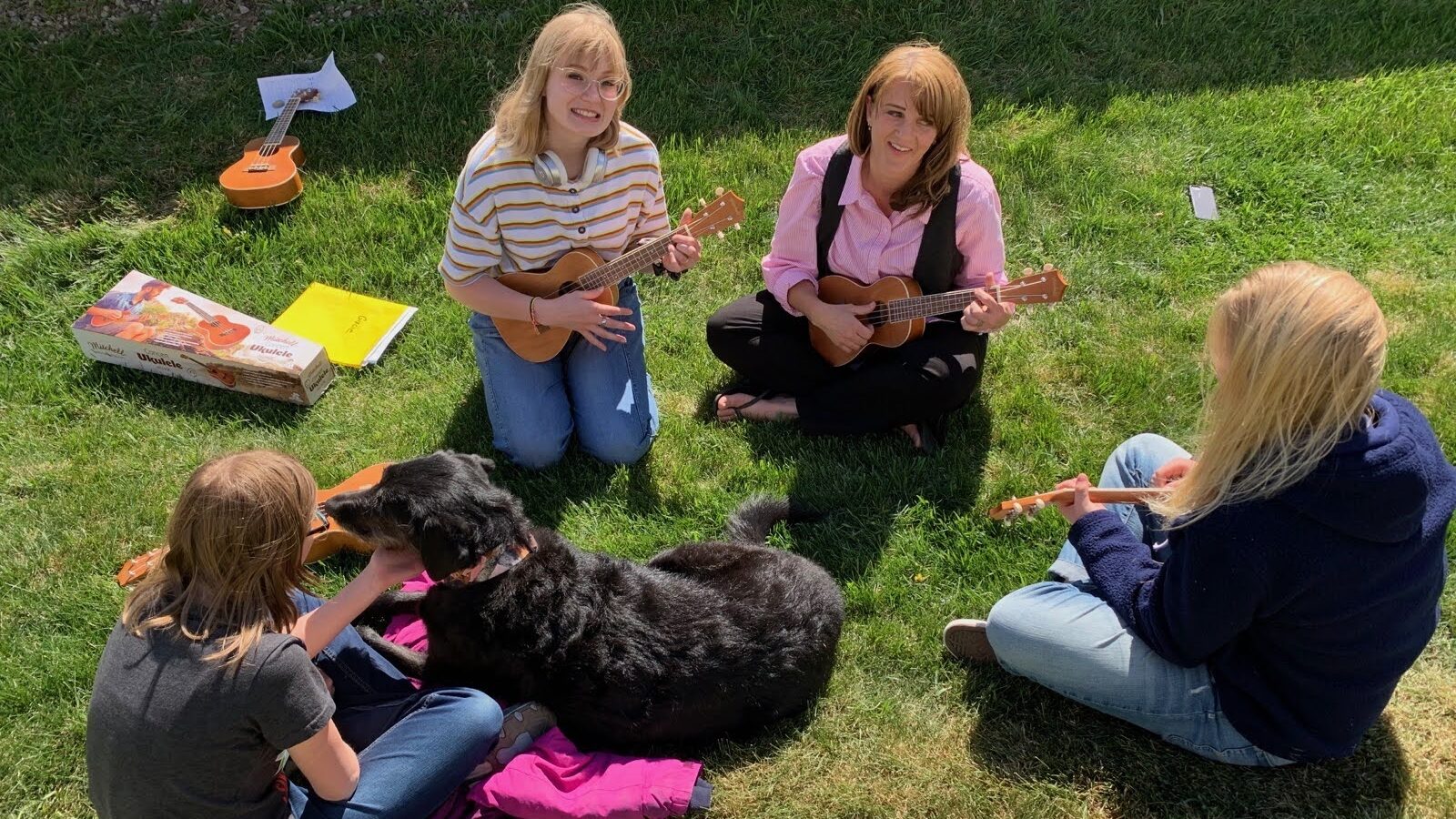 Outdoor group therapy at Logan River Academy playing ukuleles